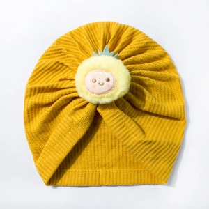 Detail of ginger waffle knit baby turban hat with a cute yellow plush flower character