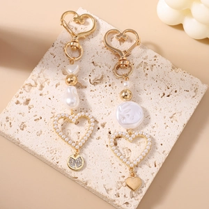 Gold heart pearl keychain with irregular baroque beads and a crystal flower pendant