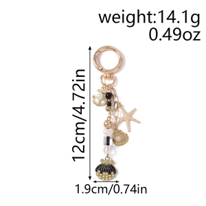 Detail view of gold ocean keychain with dimensions, anchor charm and pearl shell