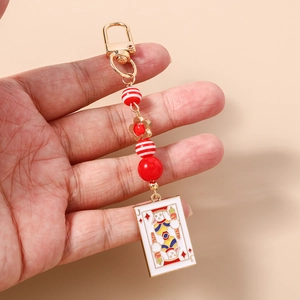 Detail of playing card J rabbit charm with colorful beads and golden lobster clasp