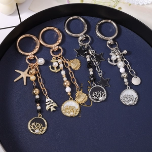 Lot de porte-clés thème océan avec étoile de mer, perles et arbre de vie élégants