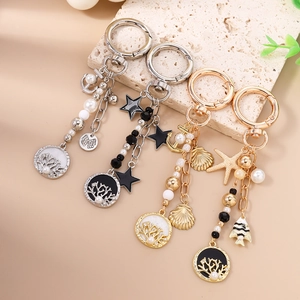 Lot de porte-clés thème océan avec étoile de mer, coquillage, perles et ancres