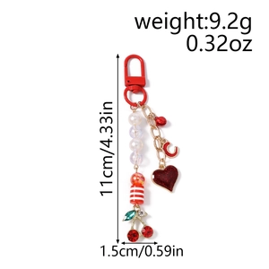 Detailed view of beaded star keychain with cherry and glitter heart charms