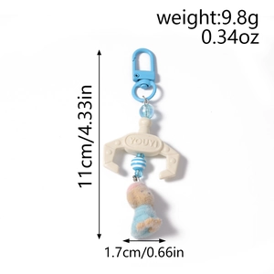 Detailed dimension view of plush sheep keychain with blue spring clip and robotic claw
