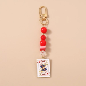 Detail of beaded keychain with king rabbit poker card charm and red resin beads