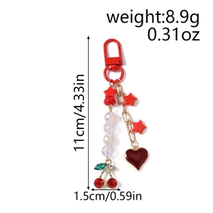 Detail view of red cherry and heart keychain dimensions 11cm length with weight 8.9g