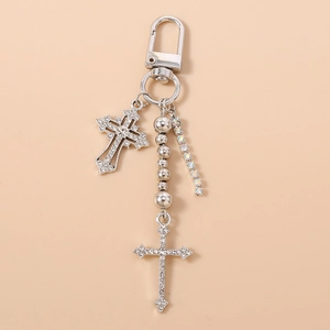 Detail of silver beaded keychain with rhinestone cross pendants and lobster clasp