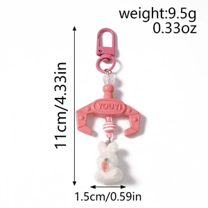 Detailed view of plush bunny keychain with pink claw, 11cm length and 9.5g weight info