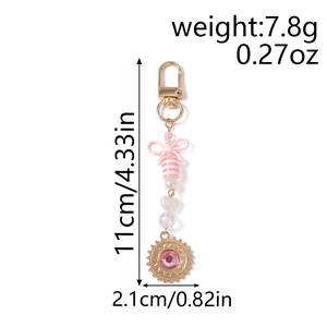 Vue détaillée du porte-clés à nœud rose avec dimensions de 11 cm et poids de 7,8 g
