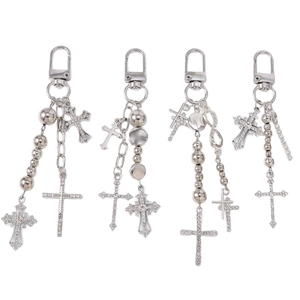 Set of four silver beaded keychains with rhinestone cross pendants and infinity symbols