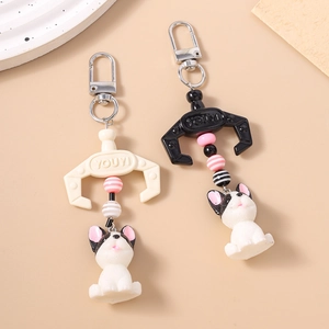 Bulldog bag charms with metal lobster clasp and colorful striped beads in black and cream