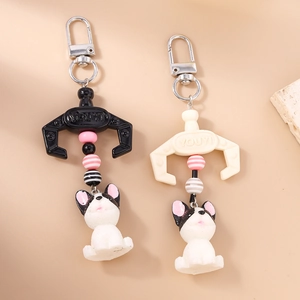 Bulldog claw machine keychain with striped beads and metal D-ring in beige and black