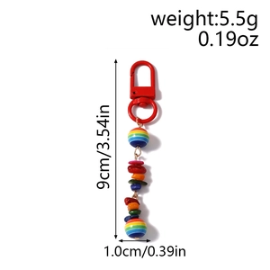 Detail view showing 9cm rainbow beaded keychain with colorful stones and red metal clasp