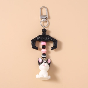 Detail view of French Bulldog keychain with colorful beads and metal claw clasp