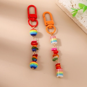 Detail of colorful striped beads and bohemian turquoise stones on vibrant keychains