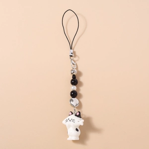 Detail of beaded phone strap featuring a cute black and white resin cat charm and silver beads