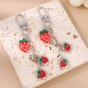 Fashionable strawberry keychain with silver metal lobster clasp and red enamel fruit charms