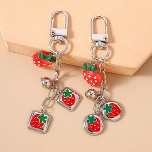 Fashionable strawberry keychain set with silver alloy charms and a small bell