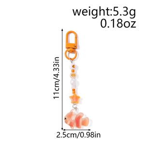 Detail view of orange clownfish keychain with size specs and star-shaped beads