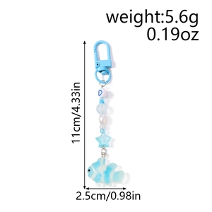 Blue and white beaded keychain with starfish and clownfish charms including size dimensions