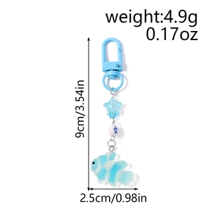 Macro detail of blue starfish keychain with dimensions showing 9cm length and 4.9g weight