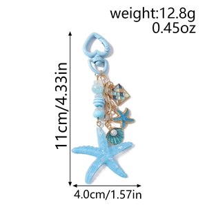 Detail view of starfish keychain with blue beads and heart-shaped hook showing dimensions