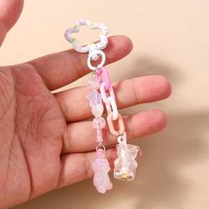 Fashionable beaded gummy bear keychain with white flower clasp and pastel pink chains