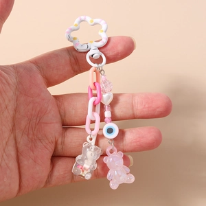Fashionable beaded bear keychain with colorful chains, heart beads, and evil eye charms