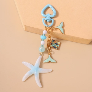 Detailed view of ocean-themed starfish keychain with beads and sea element charms