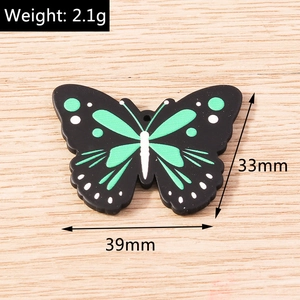 Detailed view of butterfly charms with specific dimensions of 39mm width and 33mm height