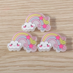 Close-up of resin rainbow pendants with clouds and stars for DIY jewelry crafting