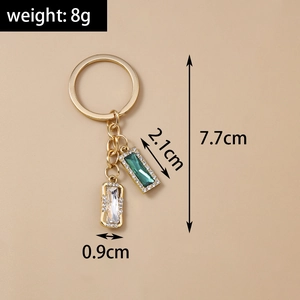 Detail showing weight and dimensions of the geometric crystal gold keychain with rhinestones