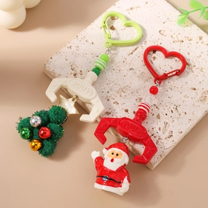 Christmas beaded mechanical claw keychain set featuring Santa and plush tree charms