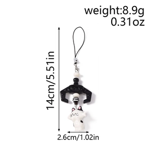 Maneki-neko phone charm detail with black mechanical claw and beads, 14cm length
