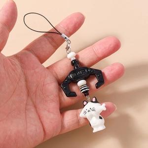 Detail shot of cute black and white cat charm phone strap with beads and YOUYI hook