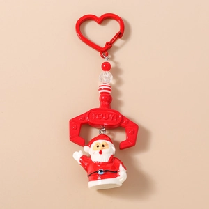 Close-up of Christmas beaded keychain with red metal heart hook and Santa Claus charm