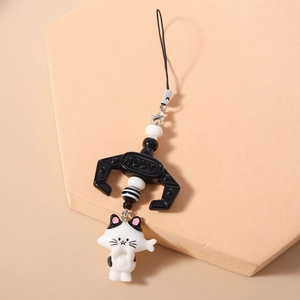 Detailed view of the cat phone charm with black and white beads and a cute 3D kitten pendant