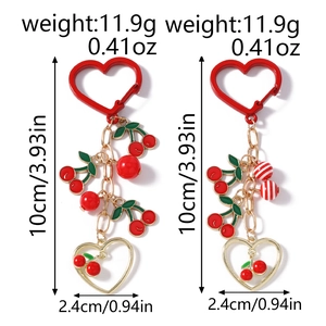 Detail view of cherry heart keychain with dimensions and weight for fashion accessories