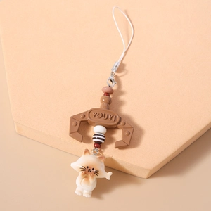 Detail of cute resin cat charm and brown claw pendant with sturdy lobster clasp