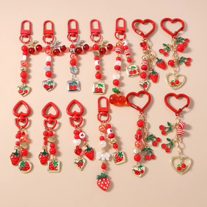 Set of 12 red beaded keychains featuring strawberry cherry and heart charms for bags