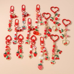 Handmade beaded strawberry and cherry keychains with gold clasps for bags