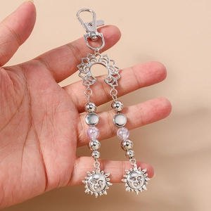 Porte-clés vintage en argent avec perles turquoise et pendentif soleil et fermoir