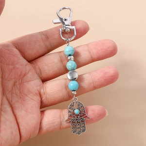 Ethnischer Hamsa-Hand Schlüsselanhänger mit Türkisperlen und silberner Metallschnitzerei