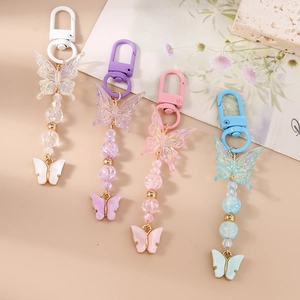 Fashionable beaded butterfly keychains in pastel colors for handbags and accessories