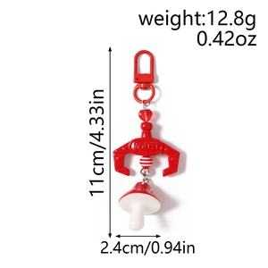 Mechanical claw mushroom keychain with red metal D-ring buckle on white background