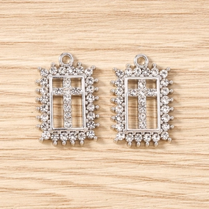 Detailed view of silver rectangular pendants with crystal pavé cross for DIY jewelry