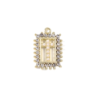Golden rectangular pendant with micro-paved rhinestones and a pearl cross center charm