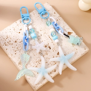 Blue ocean-themed keychain set with mermaid tail starfish charms and drink bottle