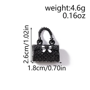 Quilted black handbag charm with bow detail and woven handle for jewelry making