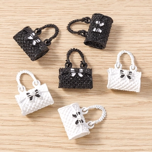 Quilted handbag charms with bow details in black and white for DIY jewelry making